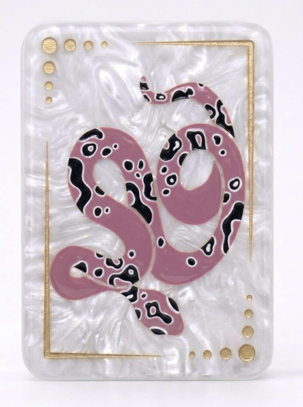 AI-generated finished mahjong tile with a pink and black snake illustration on the same pearlescent material