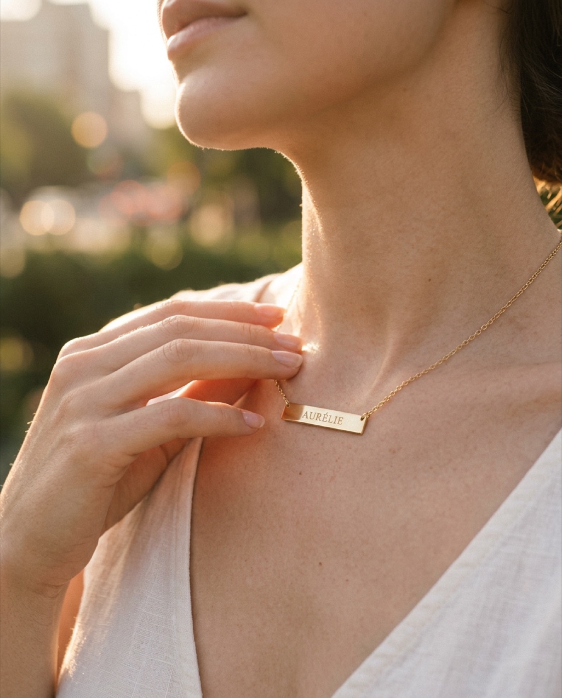 AI-generated image of a woman wearing the same personalized gold nameplate necklace outdoors